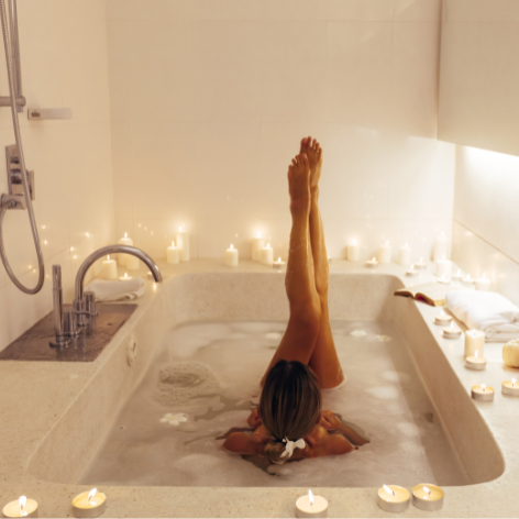 Woman Soaking in Alchemy Luxe Bath Milk Elixer Mag Elysium